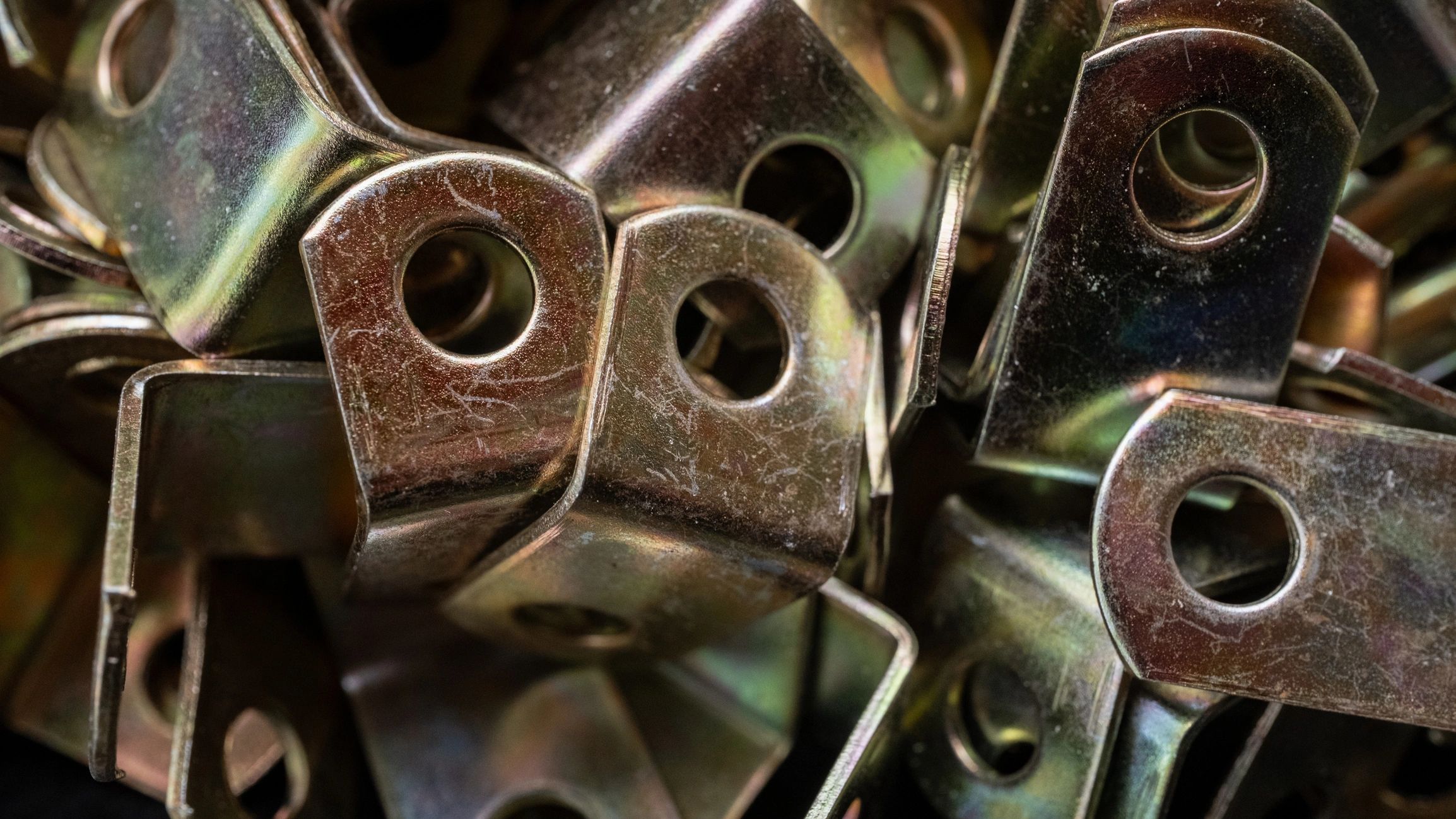 Close-up of steel fasteners and hardware representing clip angle supply