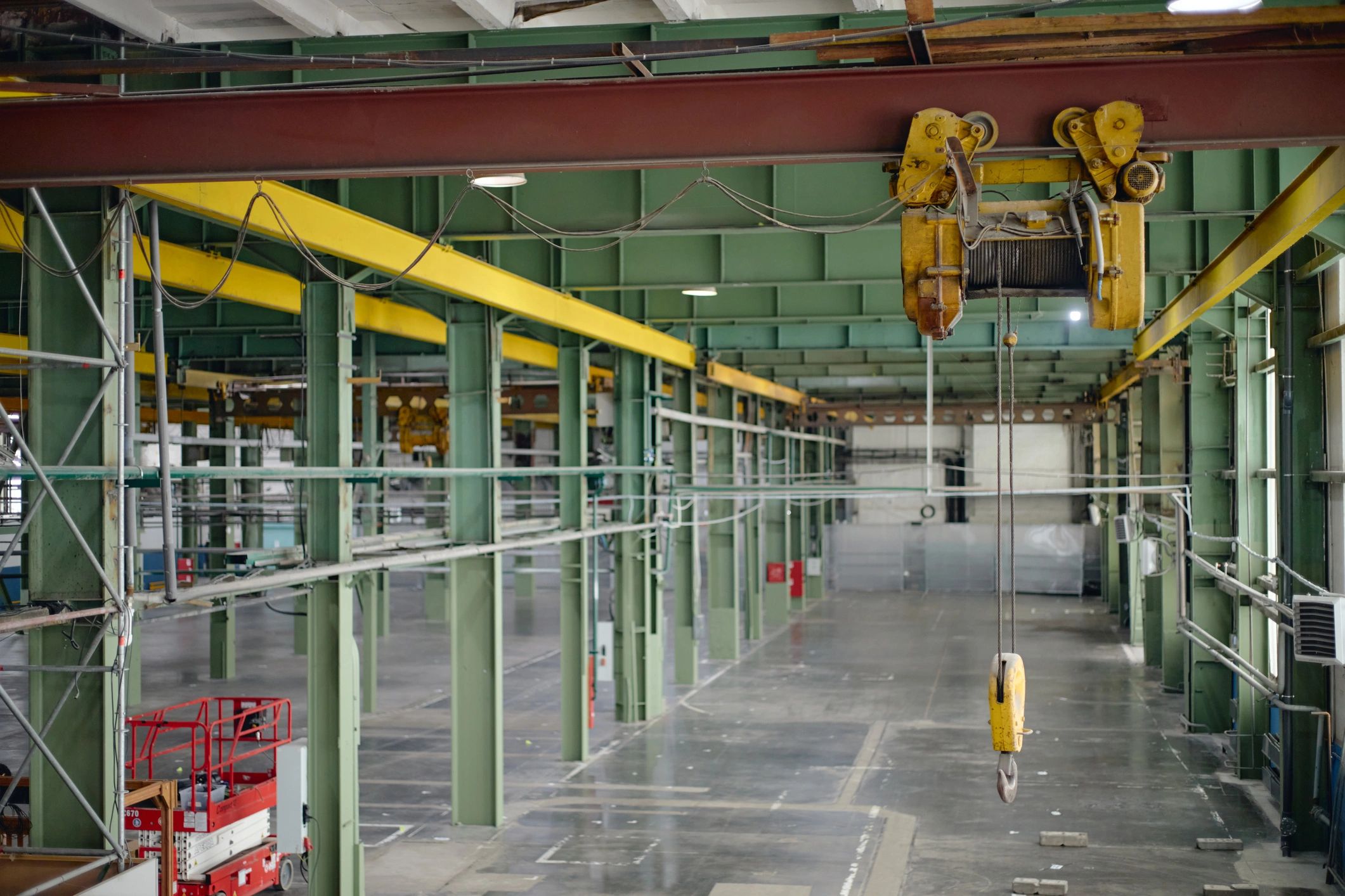 Industrial facility interior with overhead crane system